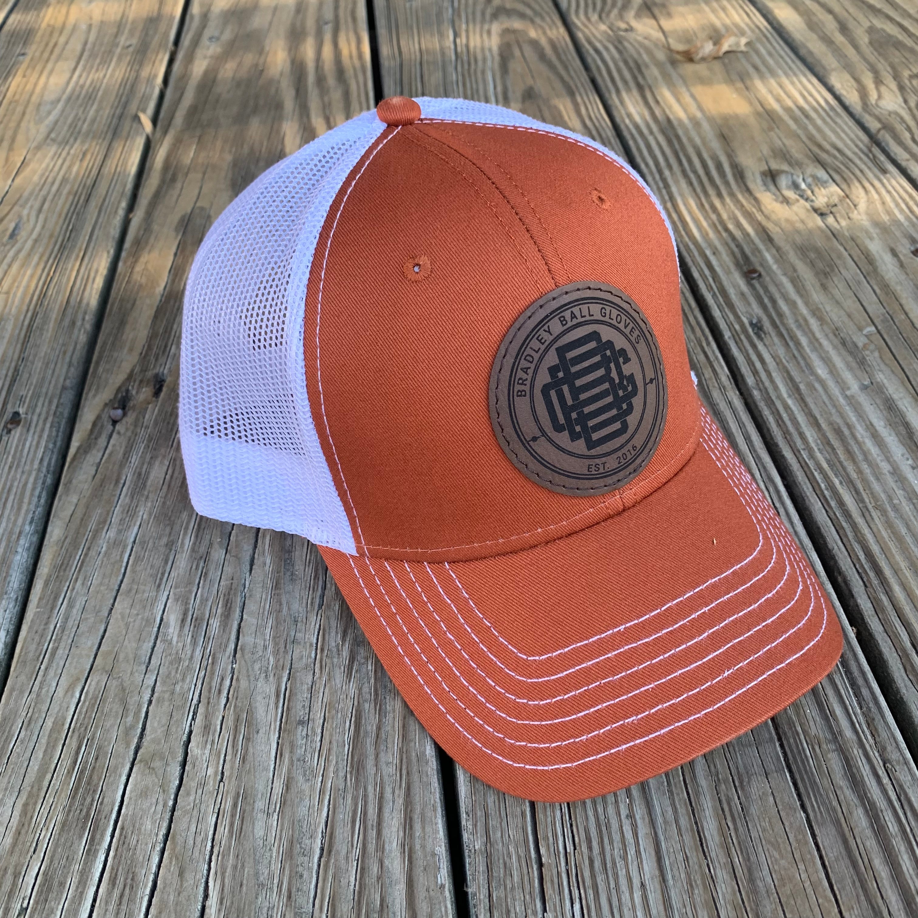 Orange and cheap white trucker hat